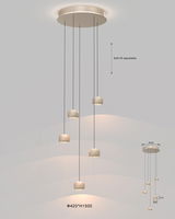 Moderne LED-Pendelleuchte mit sechs verstellbaren Leuchtkörpern, von unten betrachtet.