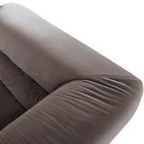 Nahaufnahme eines grauen Big-Sofas aus der Vogelperspektive, das die weiche Polsterung und die glatte Oberfläche zeigt.