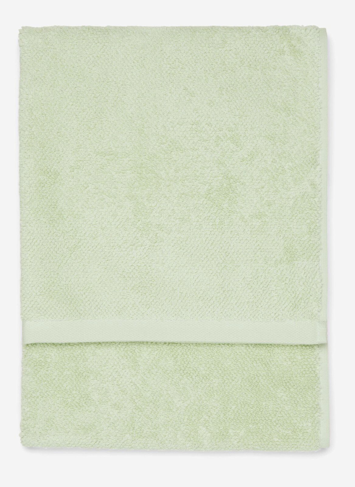 Grünes Handtuch in Nahaufnahme, flach liegend