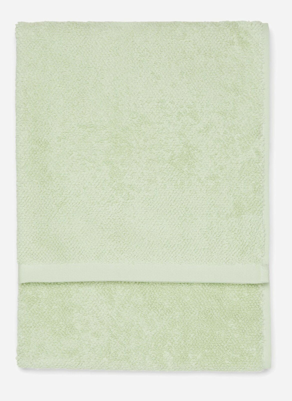 Grünes Handtuch in Nahaufnahme, flach liegend