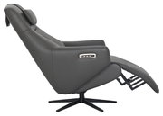 Zijaanzicht van een grijze relaxfauteuil met verstelbare rugleuning en voetsteun, op een draaibare voet.