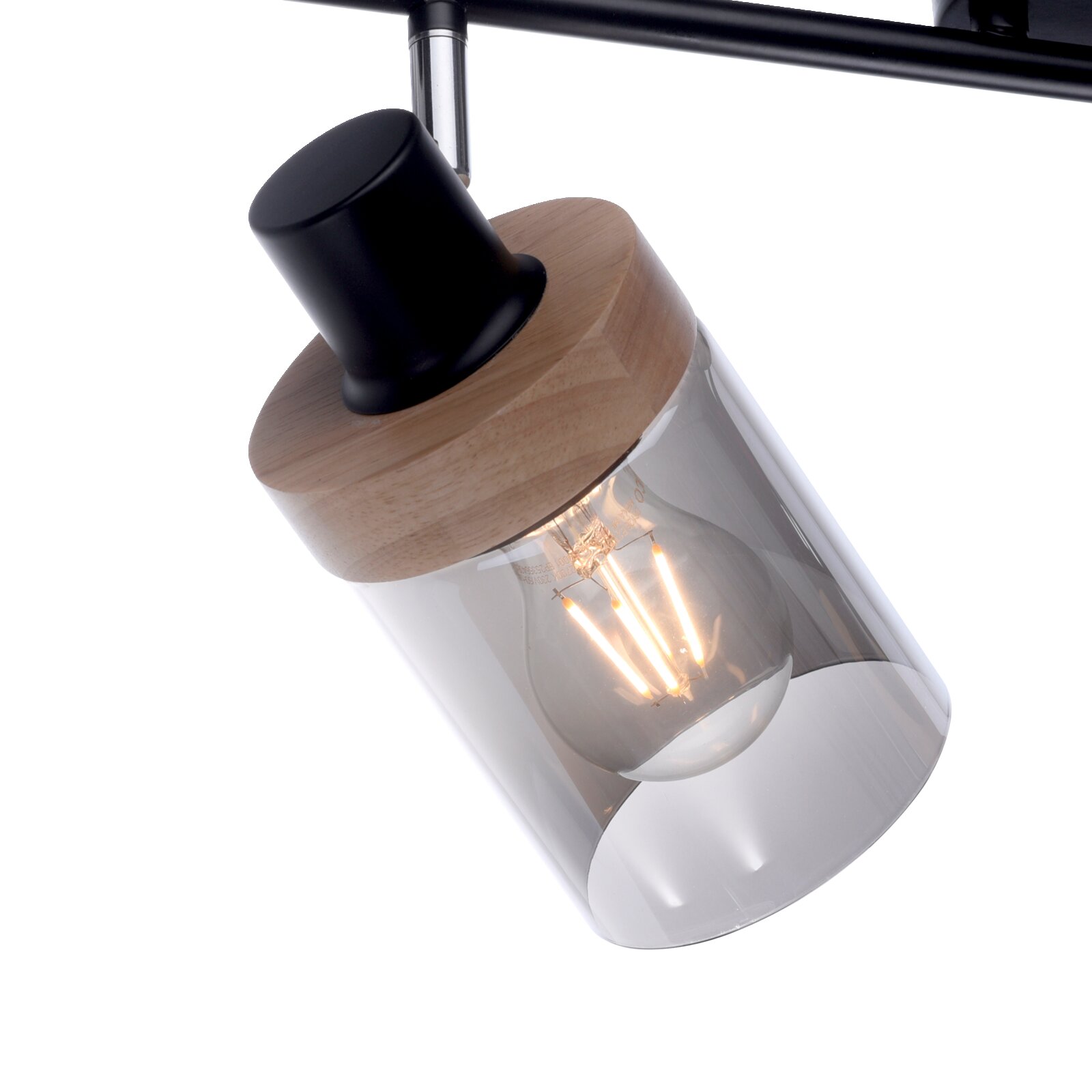 Moderne Pendelleuchte mit transparentem Glasschirm, Holzfassung und schwarzem Metallhalter, mit sichtbarer Filament-Glühbirne; Detailaufnahme aus schräger Seitenansicht von unten