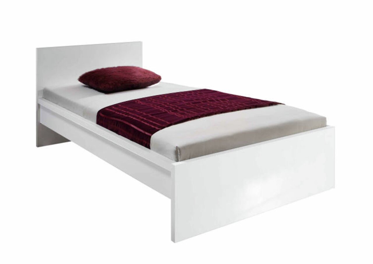 Weißes Einzelbett mit Kopfteil, rotem Kissen und roter Decke, seitliche Perspektive