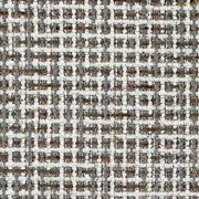 Nahaufnahme eines strukturierten Stoffmusters in einem geometrischen Design mit weißen, grauen und bunten Fäden.