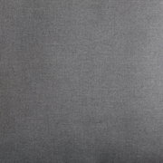 Nahaufnahme eines grauen Stoffes, vermutlich Teil eines Lounge-Sets, mit texturierter Oberfläche.