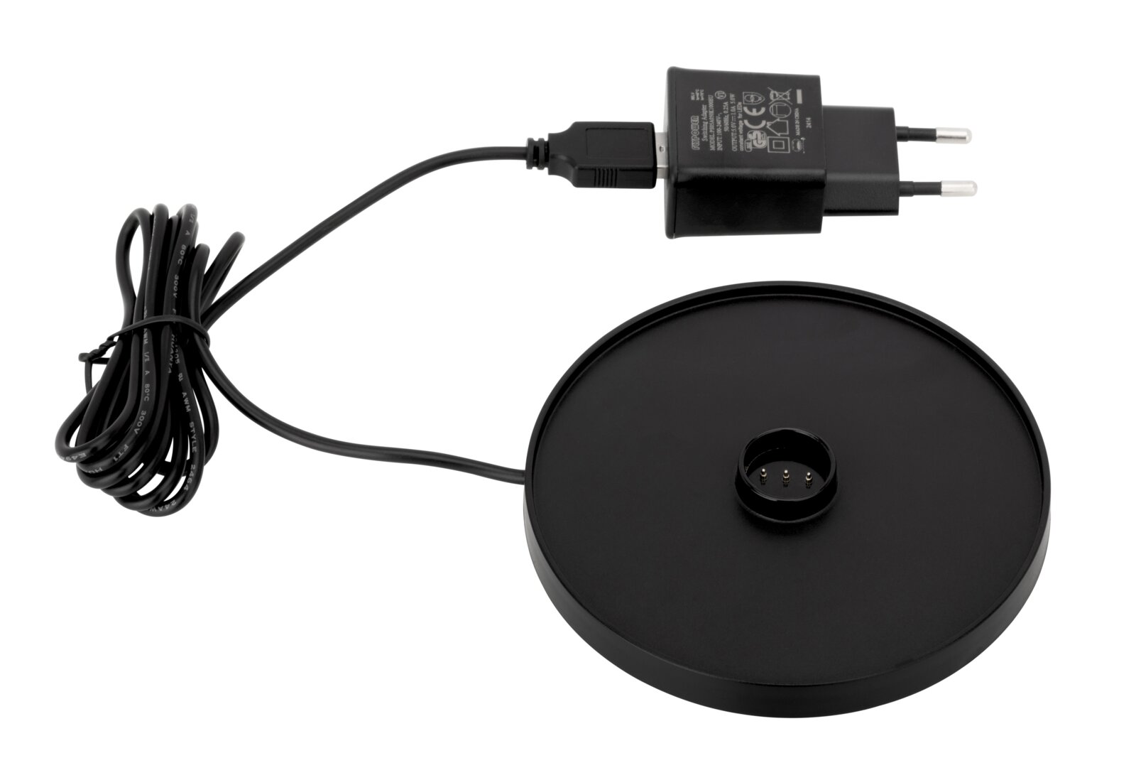 Zwarte oplader met kabel en ronde voet voor een accu-tafellamp, gezien van bovenaf