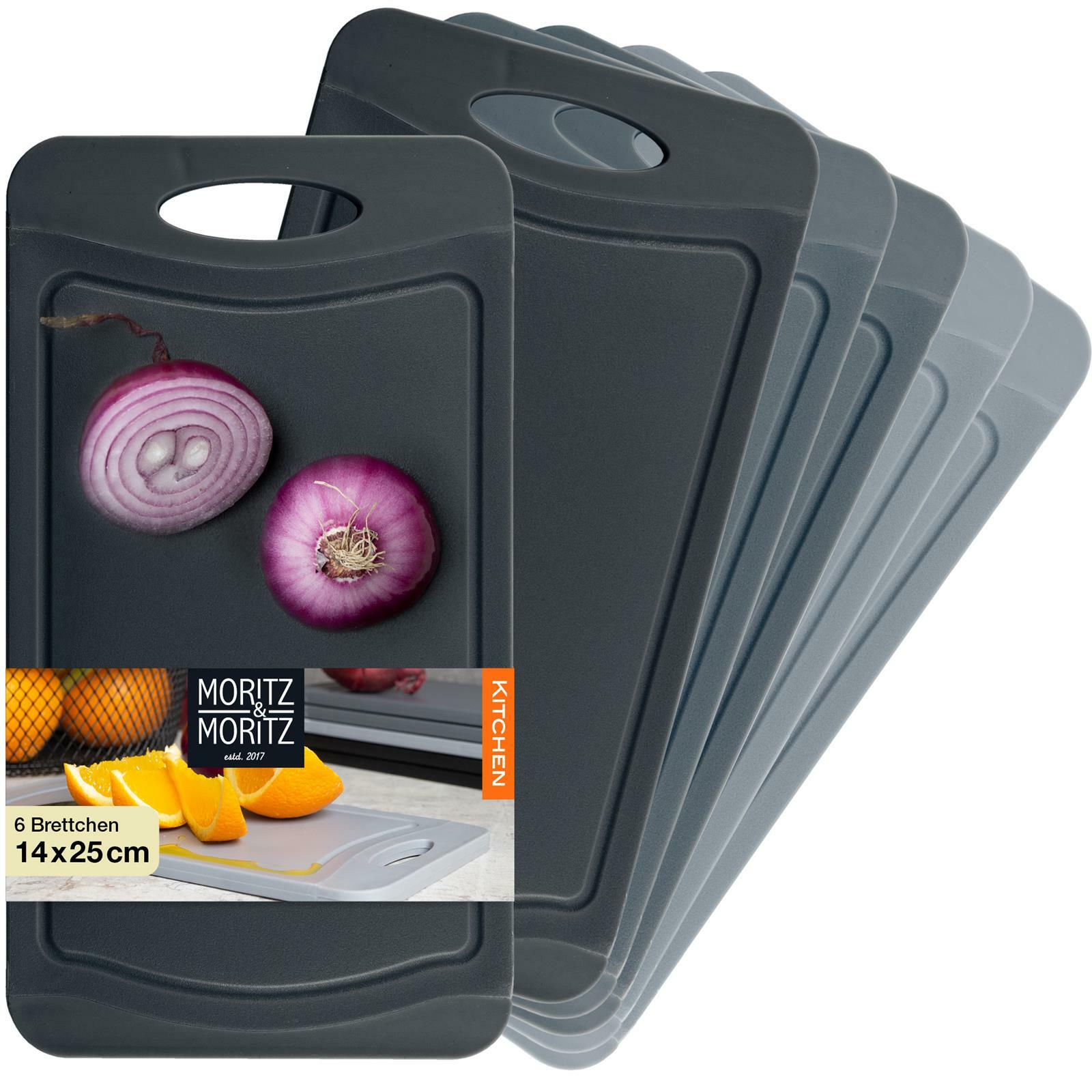 Set aus sechs grauen Schneidebrettern mit Griffloch, Vorderansicht, eines mit aufgeschnittener Zwiebel und Orangenabbildung.