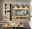 Wohnwand aus Holz mit Vitrine, TV-Schrank und Wandregal, frontal betrachtet.