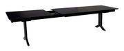 Moderner Esstisch in dunklem Holz, ausziehbar, seitliche Perspektive