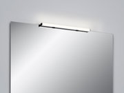 Moderne wandlamp LADO-S boven een spiegel, zijaanzicht