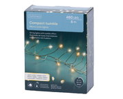 Verpackung der Lumineo Compact Twinkle Micro LED Lichterkette mit 480 warmweißen LEDs auf 6 m Länge, goldener Draht, 8 Funktionen, Timer 8h an/16h aus, Vorderansicht.