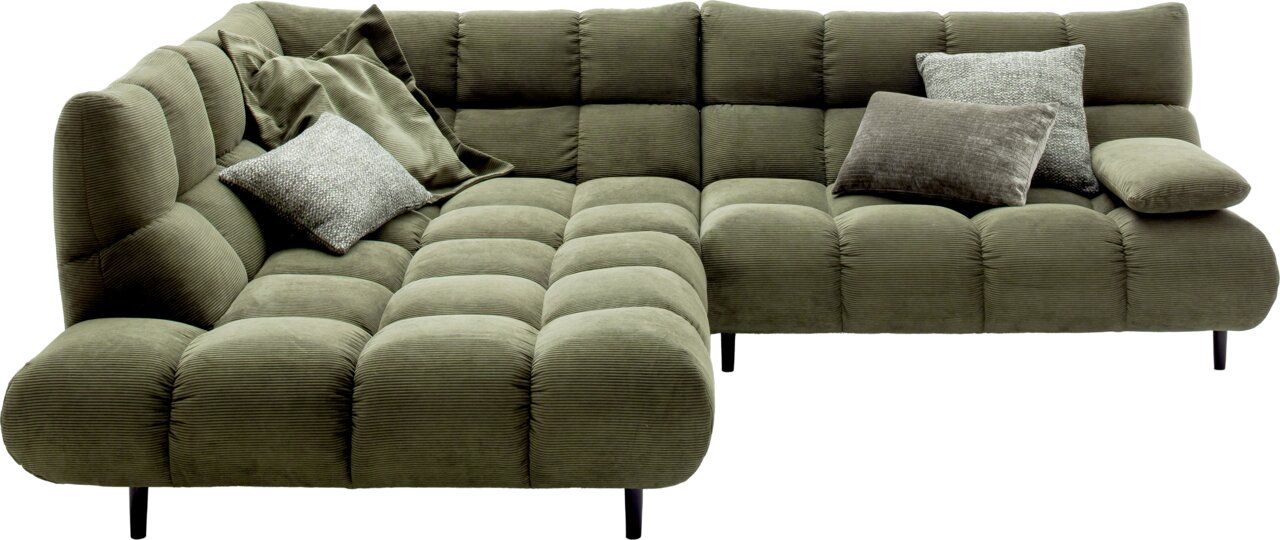 Pure Home Lifestyle Ecksofa Grüne Eckgarnitur mit Kissen, aus einer leicht erhöhten Perspektive fotografiert.