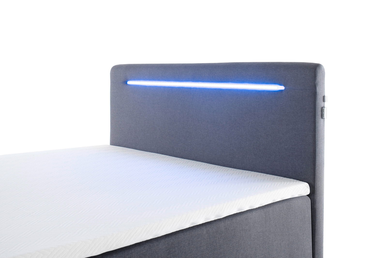 Boxbett mit grauem Kopfteil und integrierter blauer LED-Beleuchtung, seitliche Perspektive