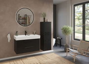 Modernes Waschtisch-Set in einem stilvollen Badezimmer mit schwarzem Schrank und rundem Spiegel, seitliche Perspektive.