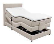 Beiges Boxspringbett mit verstellbarem Kopf- und Fußteil, seitliche Perspektive