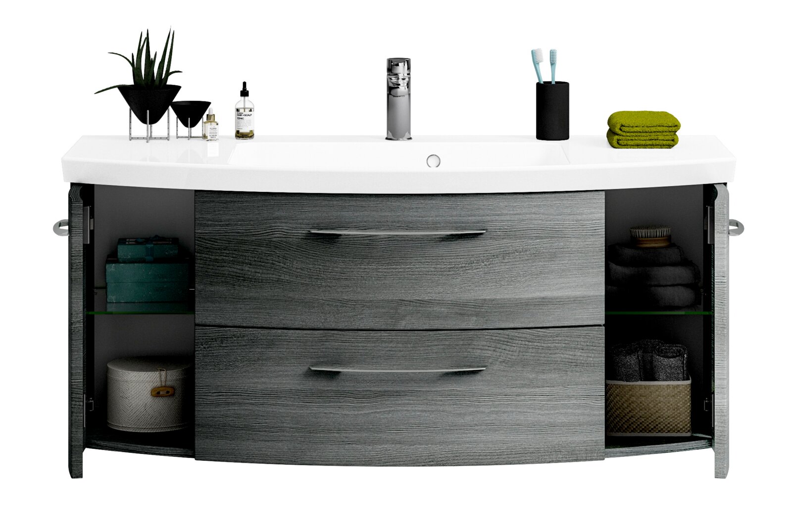 Moderne wastafel met grijze houtlook, twee lades en open zijdeuren, gezien vanaf de voorkant. Versierd met planten, een zeepdispenser en een tandenborstelhouder.