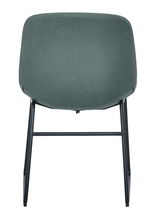 Rückansicht eines modernen Stuhls mit grünem Stoffbezug und schwarzen Metallbeinen.