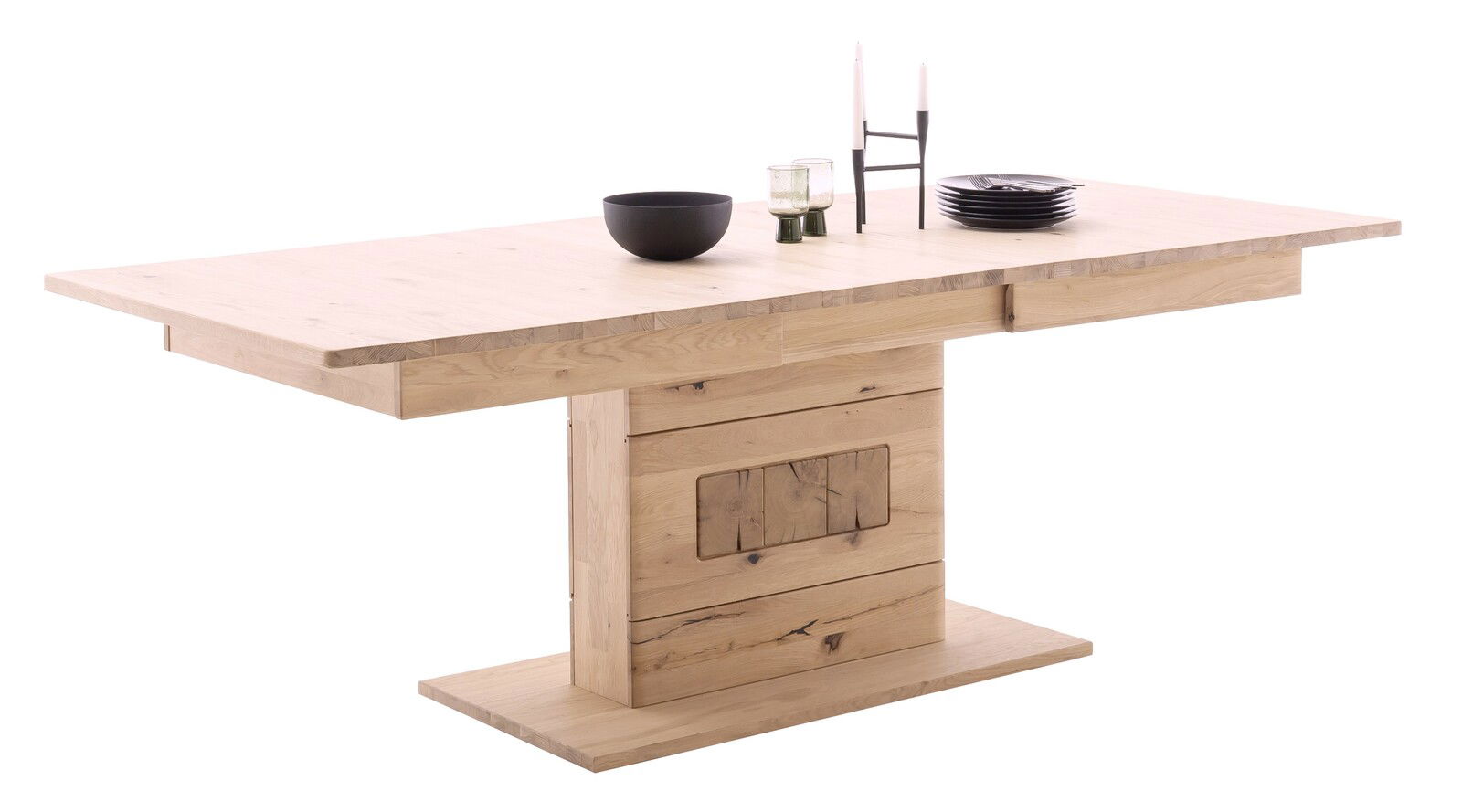 Moderner Esstisch aus hellem Holz mit zentralem Standfuß, seitliche Perspektive