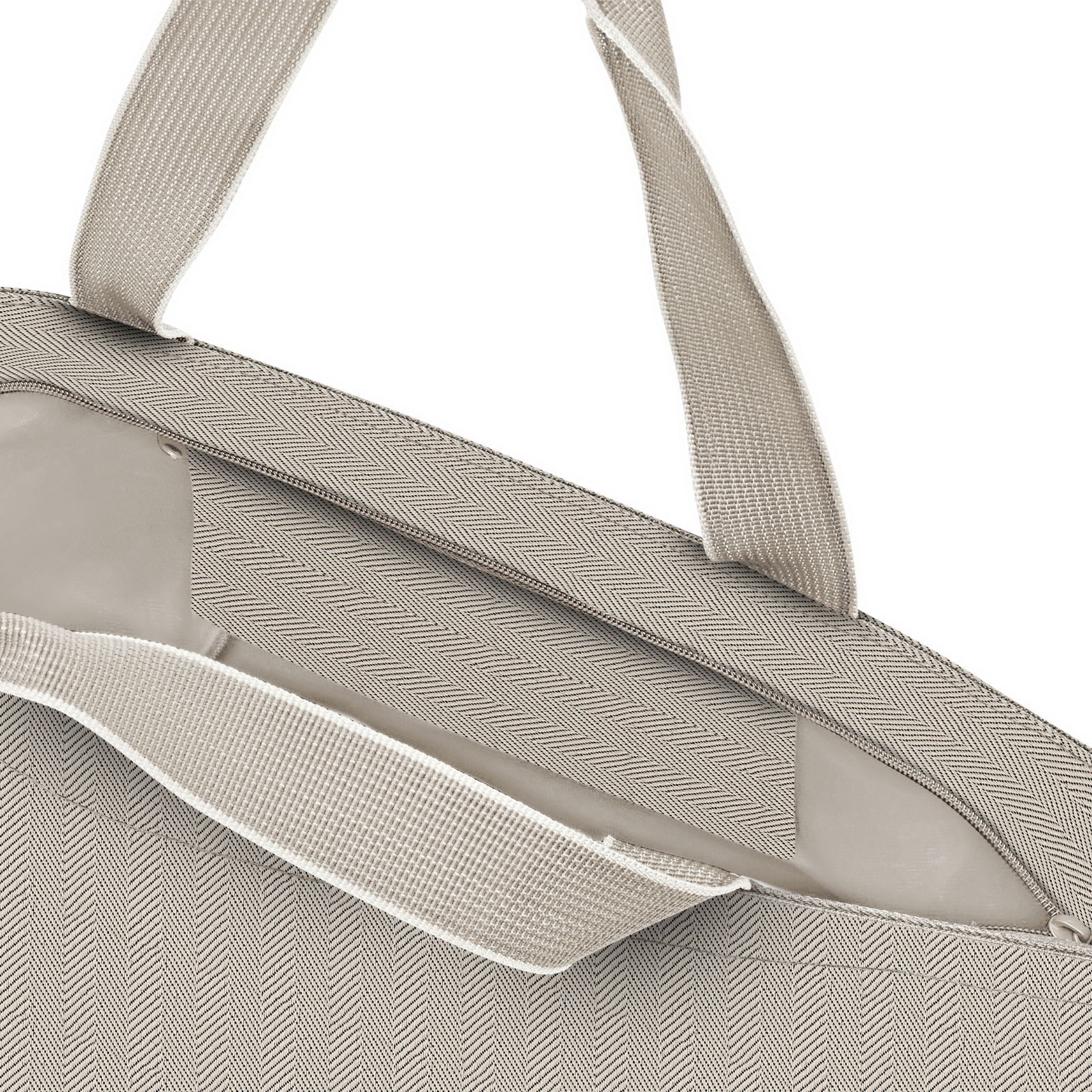 Nahaufnahme eines Shopper-Tasche in Herringbone-Muster, Farbe Sand, mit robusten Tragegriffen.
