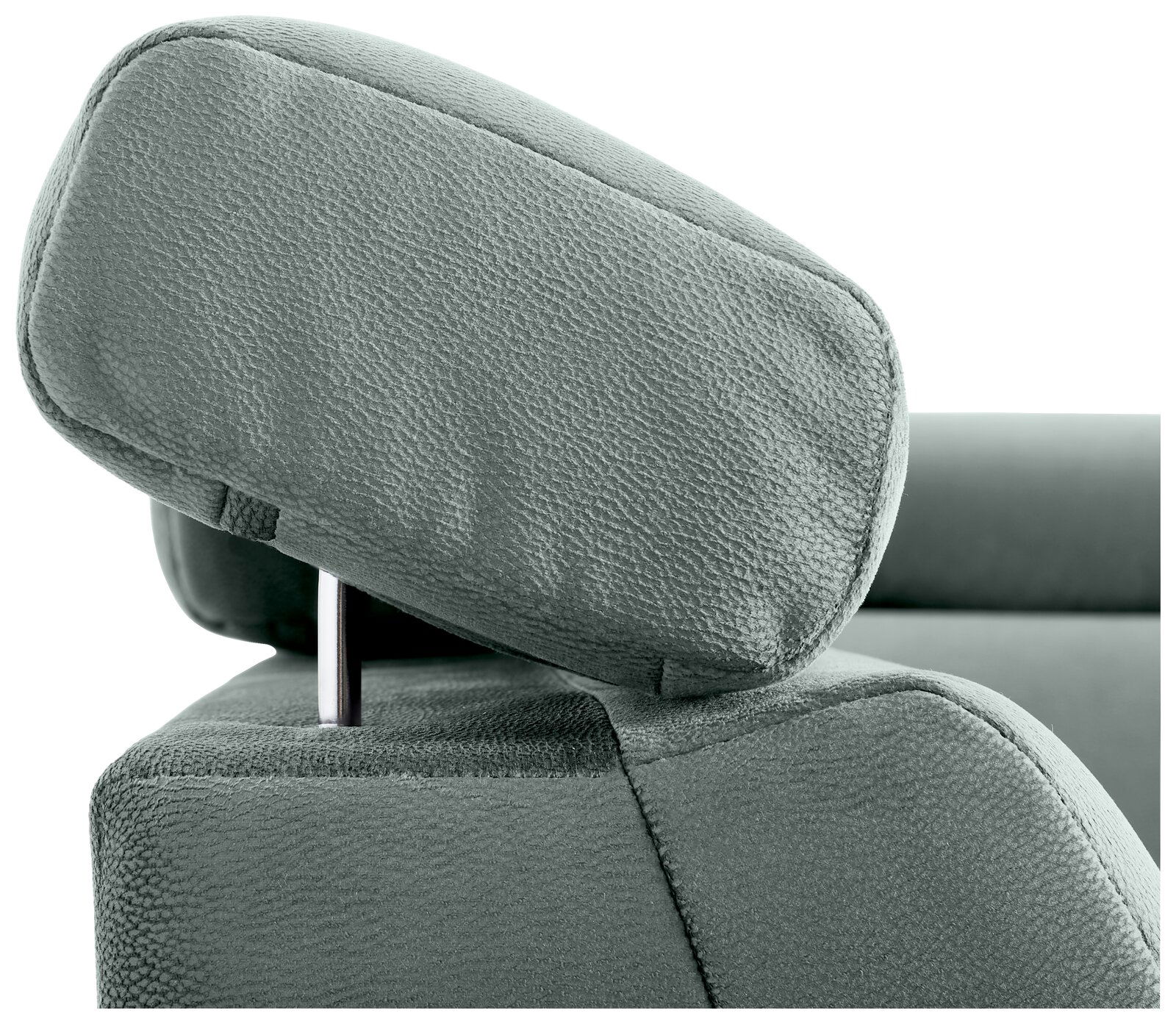Nahaufnahme einer grünen Kopfstütze eines Sofas aus Stoff, seitliche Perspektive