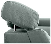 Nahaufnahme einer grünen Kopfstütze eines Sofas aus Stoff, seitliche Perspektive