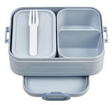 Graue Bento-Lunchbox mit mehreren Fächern und einem weißen Besteck, aus der Vogelperspektive.