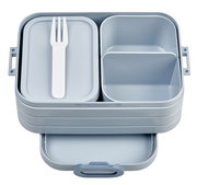 Graue Bento-Lunchbox mit mehreren Fächern und einem weißen Besteck, aus der Vogelperspektive.