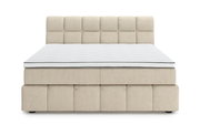 Frontale Ansicht eines beigen Boxspringbetts mit gestepptem Kopfteil und weißer Matratze.