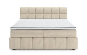 Vooraanzicht van een beige boxspring met een doorgestikt hoofdeinde en een wit matras.