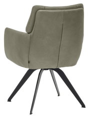Achterkant van een moderne fauteuil met groene bekleding en zwarte metalen poten.