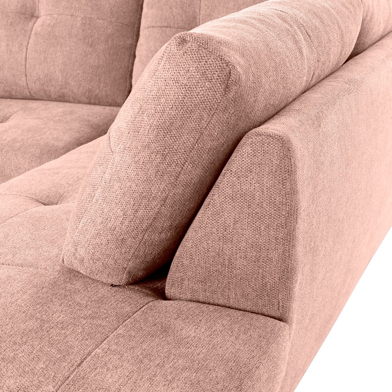 Nahaufnahme einer rosa gepolsterten Sofaecke mit sichtbarer Rückenlehne und Armlehne von der Seite.