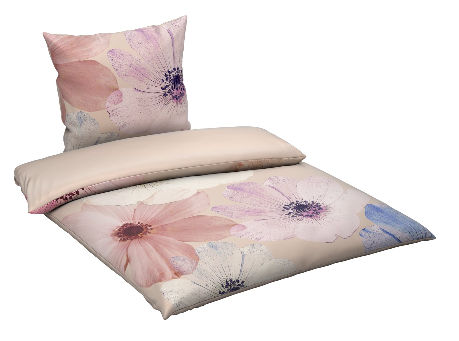 Wendebettwäsche mit großflächigem Blumenmuster in Pastelltönen, perspektivisch von schräg oben fotografiert.