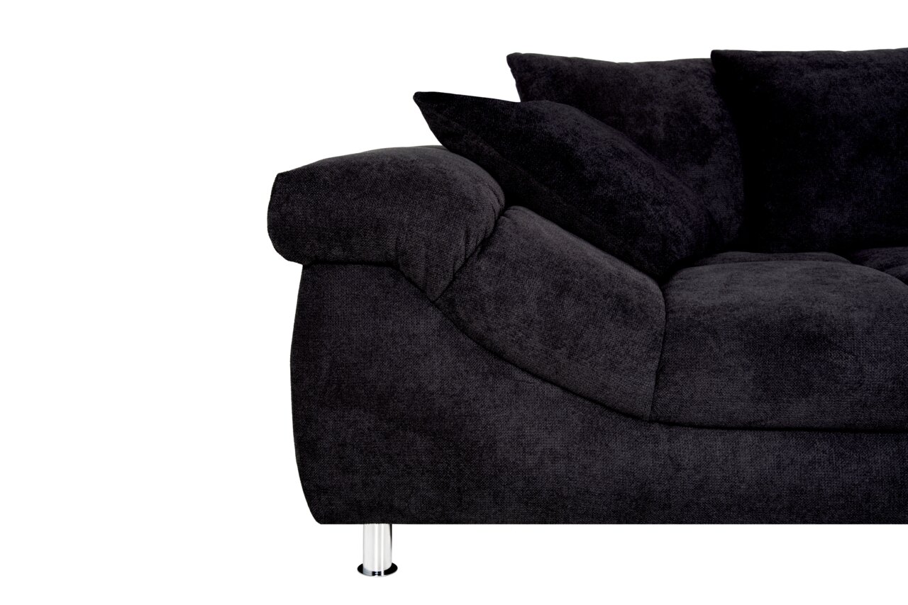 Dunkelgraue Rundecke mit weichen Kissen und verchromten Füßen, seitliche Perspektive