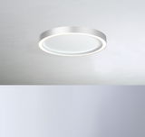 Moderne runde Deckenleuchte AURA in Weiß, von unten betrachtet, mit sanftem Lichtschein.