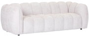 Großes, cremefarbenes Sofa mit abgerundeten Kanten und gepolsterten Segmenten, seitliche Perspektive