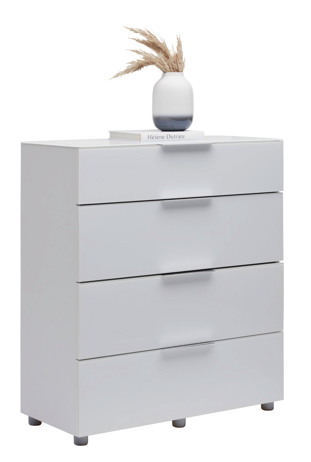 Weiße Schubkastenkommode mit vier Schubladen, dekoriert mit einer Vase und einem Buch, seitliche Perspektive