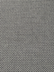 Nahaufnahme eines strukturierten Stoffmusters in Schwarz und Weiß, von oben betrachtet.