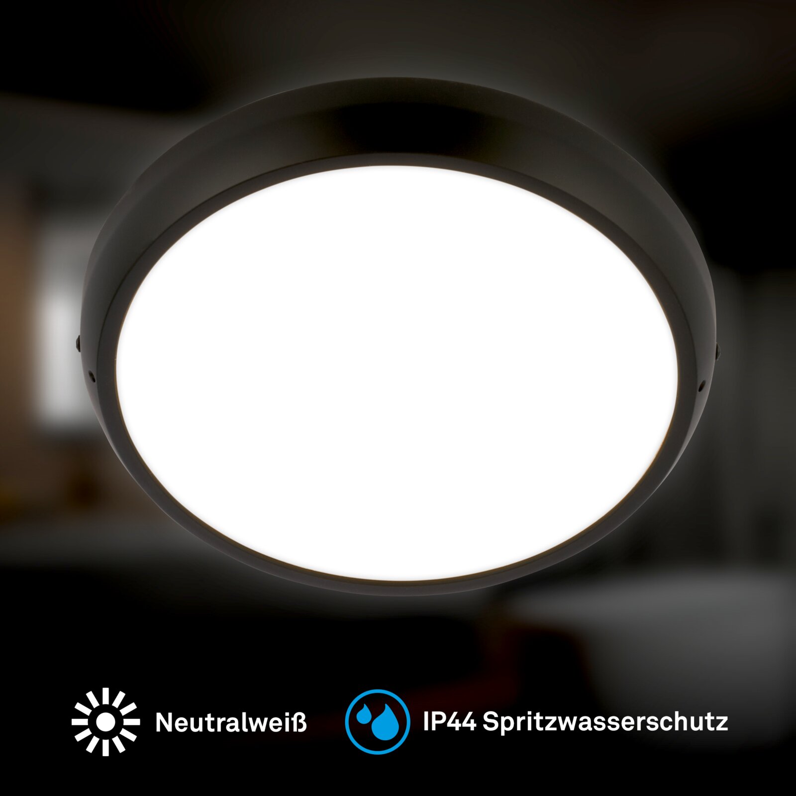 Ronde zwarte LED-plafondlamp met neutraalwit licht en IP44 spatwaterbescherming, frontaal van voren gefotografeerd.