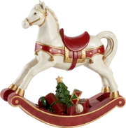 Schaukelpferd XL in seitlicher Ansicht mit rotem Sattel und weihnachtlichen Geschenken darunter.