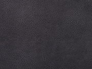 Nahaufnahme eines dunkelgrauen, strukturierten Stoffes, möglicherweise Lederoptik, von oben betrachtet.