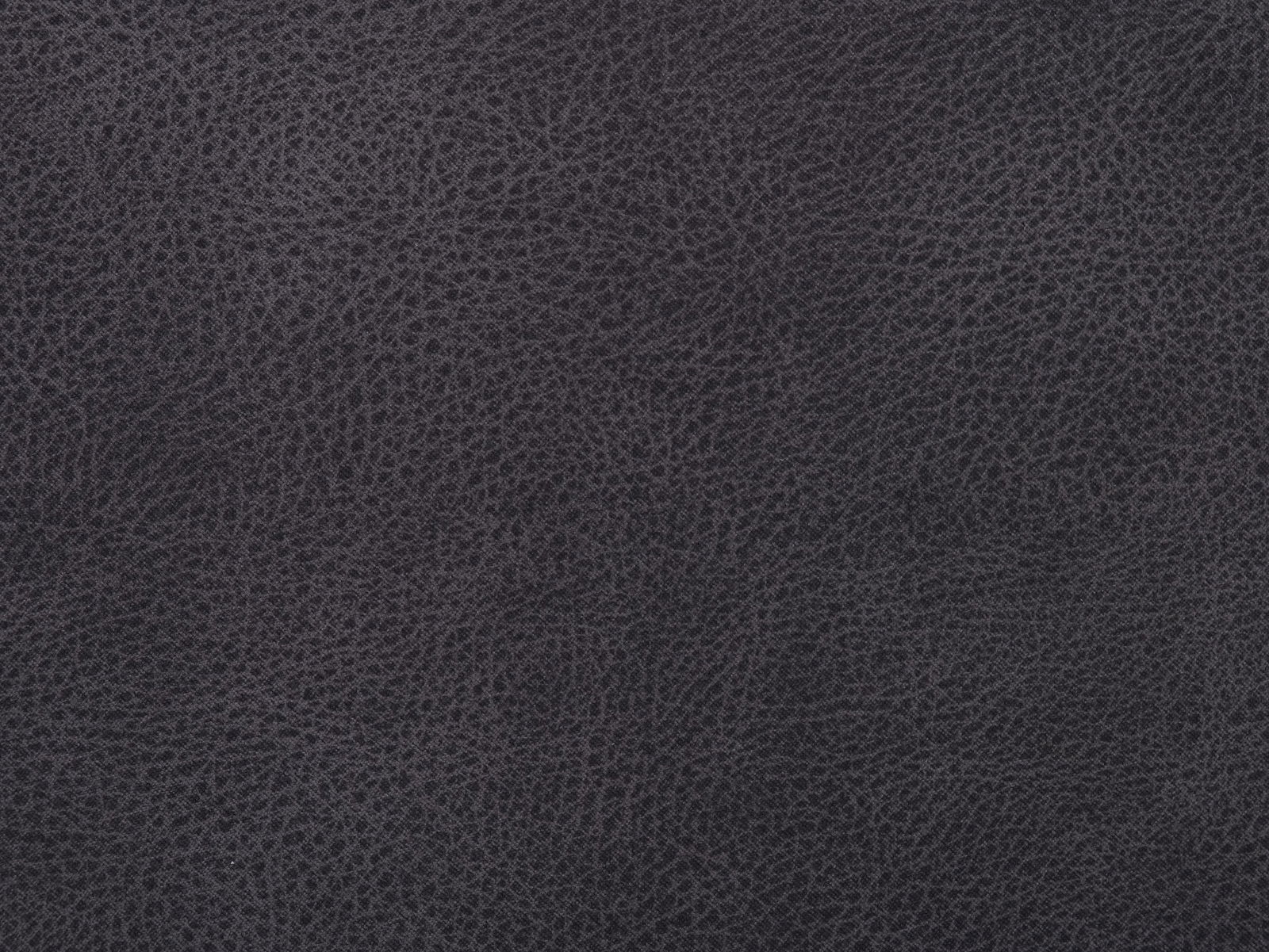 Nahaufnahme eines dunkelgrauen, strukturierten Stoffes, möglicherweise Lederoptik, von oben betrachtet.
