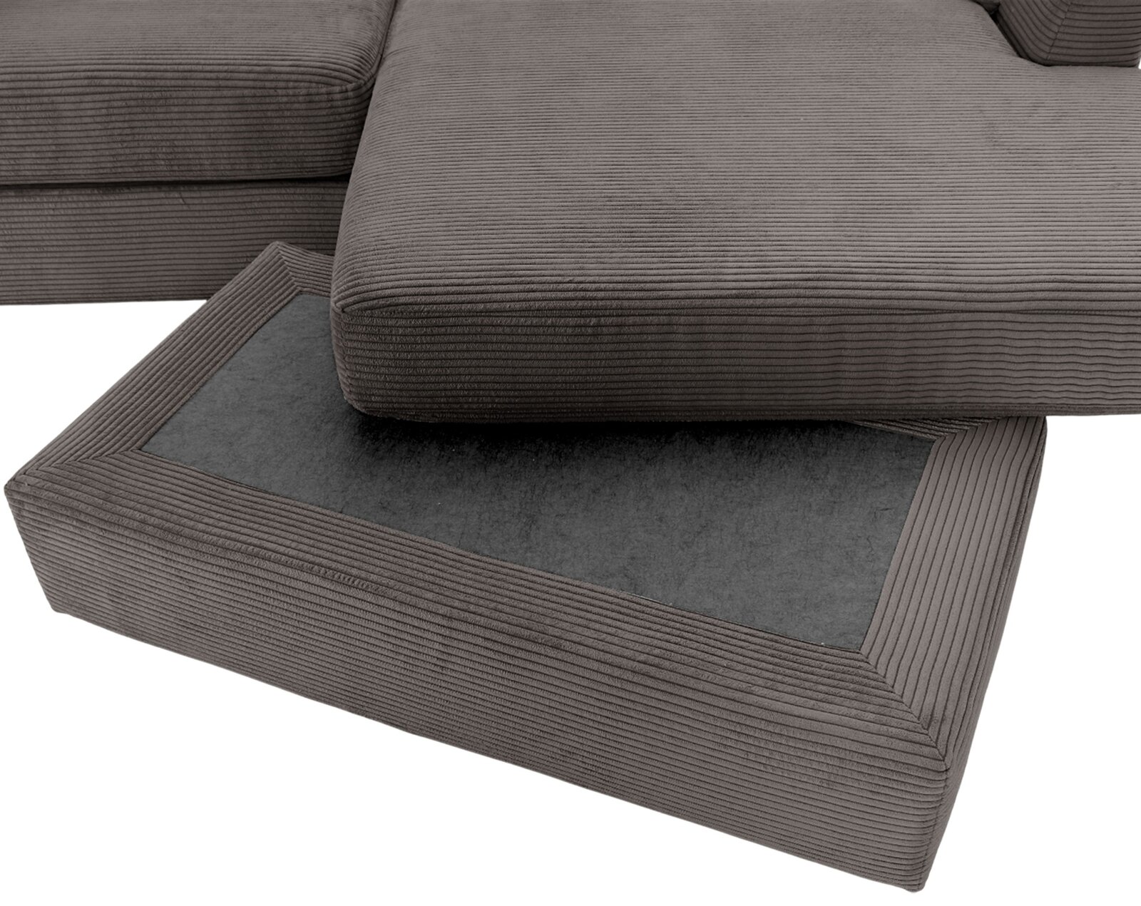 Close-up van een grijze ronde hoek met geribbelde stoffen bekleding, gezien van bovenaf.