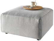 Grauer Hocker mit gerippter Oberfläche, darauf ein Tablett mit Tasse und Besteck, seitliche Perspektive