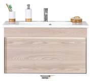 Moderne wastafel met houtlook, van voren gefotografeerd, met ingebouwde wasbak, zeepdispenser en tandenborstelhouder.