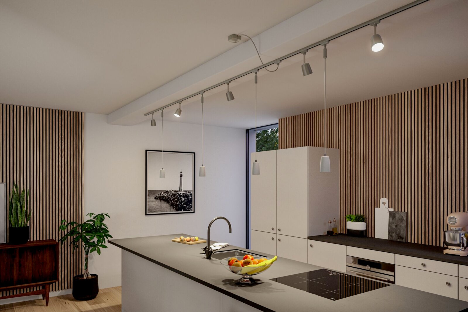 Moderne Küche mit URAIL Schienensystem und hängenden Lampen, seitliche Perspektive.
