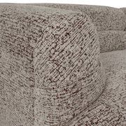 Nahaufnahme einer Ecke eines Megasofas mit strukturiertem Stoffbezug in Beige- und Brauntönen.