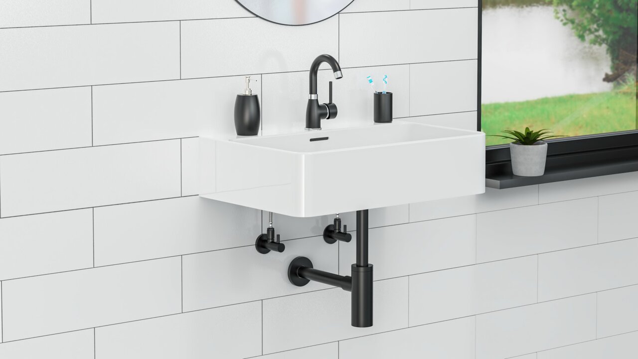 Design-afvoer in matzwart onder een moderne wastafel, zijaanzicht