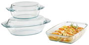 Zwei gestapelte Glasschüsseln mit Deckeln und eine rechteckige Auflaufform mit gebackenem Gemüse, seitliche Perspektive