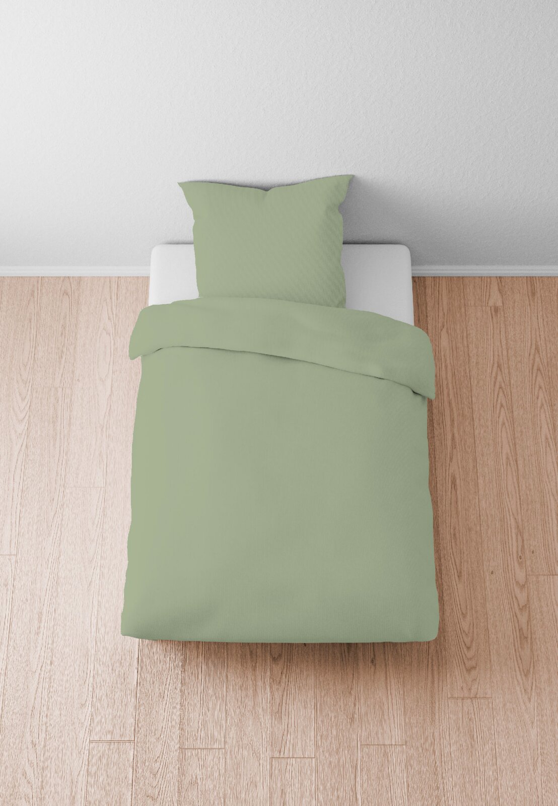 Biberna Beddengoed 135x200 cm Groen beddengoed van 135 x 200 cm op een bed, bovenaanzicht
