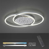 Moderne Deckenleuchte aus Stahl mit zwei überlappenden LED-Ringen und funkelndem Sternenhimmel-Effekt, seitliche Perspektive.